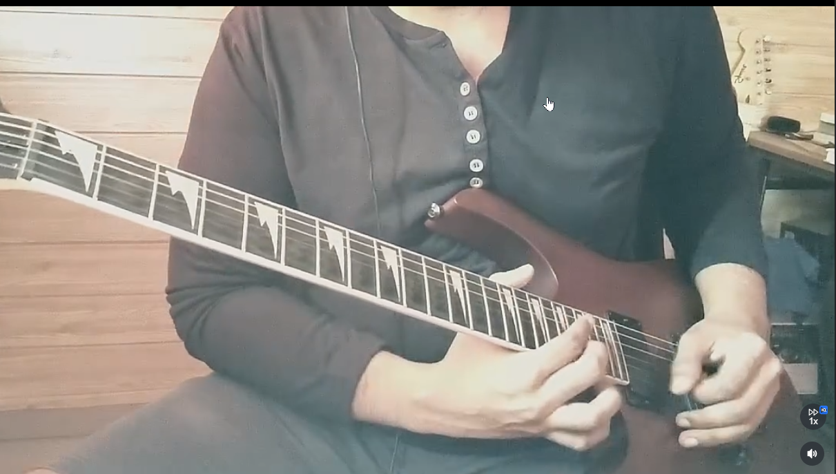 Shami Manohar playing electric guitar